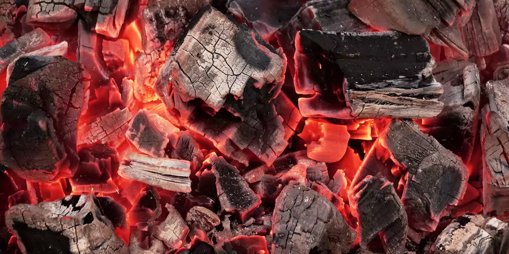 Lump charcoal on a grill